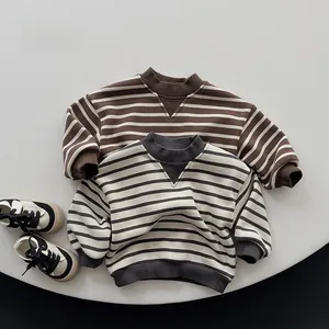 Detail of striped kids sweatshirts featuring ribbed cuffs and layered collar design