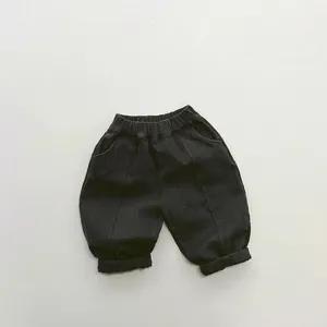 Detail view of children's fleece casual trousers with elastic waistband and side pockets