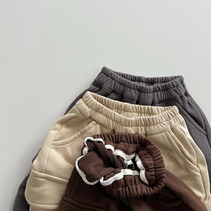 Kids casual knit jogger shorts in dark grey, beige, and brown with elastic waistband
