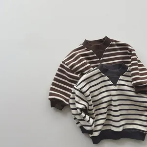 Detail of striped kids sweatshirts with ribbed V-neckline and soft cotton texture