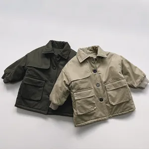 Detailed view of padded kids parkas with large cargo pockets and ribbed cuffs