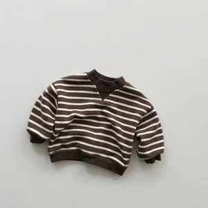 Detail of the cozy ribbed neckline and retro triangular knit insert on striped kids sweater