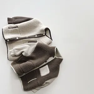 Detailed close-up of soft sherpa fleece jackets for kids with contrasting pocket stitching