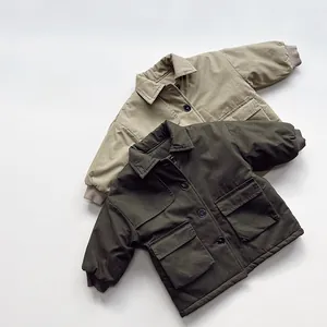 Flat lay of two padded winter coats for kids in khaki and olive green with cargo pockets