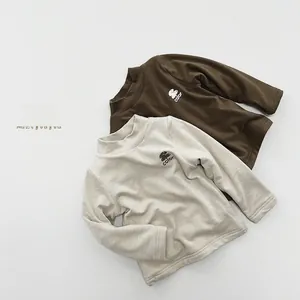 Detail view of two warm long-sleeve high-neck tops in dark brown and beige grey