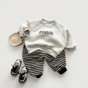 Kids warm fleece sweatshirt and striped joggers set in beige and black with small bear bag