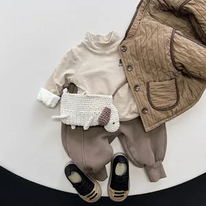 Kids warm fleece-lined beige turtleneck with quilted brown vest and sweatpants outfit