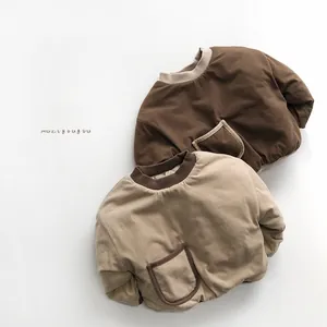 Detail of padded cotton baby sweatshirts in brown and khaki with contrast ribbed neckline