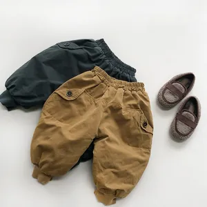 Detailed flat lay of thermal cargo pants for kids with elastic waist and side pockets