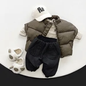 Kids warm winter outfit set featuring brown puffer vest and stylish black jogger pants