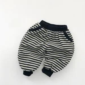 Close-up of baby striped jogger pants with elastic waistband and ribbed cuffs