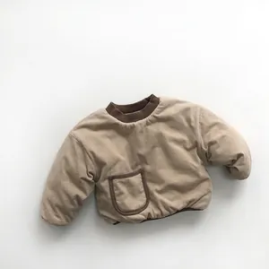 Close-up of baby padded top with contrast ribbed collar and a brown-trimmed front pocket