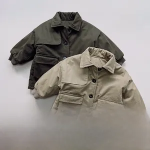 Detailed view of kids winter trench coats featuring retro collars and ribbed windproof cuffs