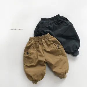 Detailed view of khaki and grey fleece children's cargo pants with elastic waist and pockets