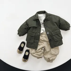 Flat lay of kids olive green cotton parka set with beige cargo pants and sneakers