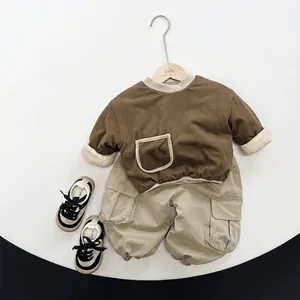 Cozy padded baby cotton top with cargo pants outfit in warm brown and beige tones