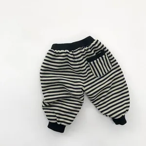 Detail of baby striped joggers featuring elastic ribbed waistband and back pocket