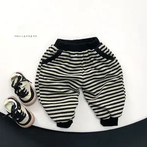 Detailed view of kids striped joggers with black ribbed waistband and elastic ankle cuffs