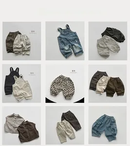 Detailed collection of children's cotton overalls and striped trousers in earthy tones