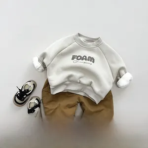 Close-up of winter fleece lining on kids casual sweatshirt showing thick warm texture