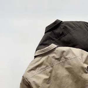 Detail of Harajuku style padded cotton trench coat showing collar and twill texture