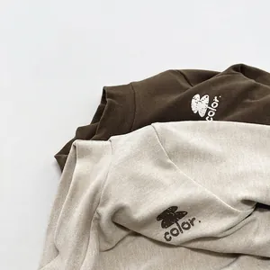 Minimalist kids fleece-lined thermal tops in oatmeal and dark coffee colors