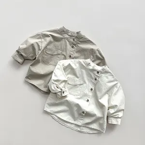 Detailed macro view of cotton linen fabric texture and wooden buttons on kids shirts