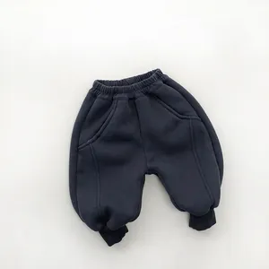 Detailed view of elastic waist and drawstring on thick fleece lined navy trousers