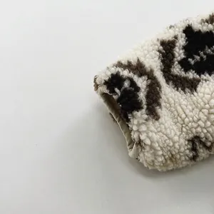 Plush lamb wool winter jacket for children with brown floral patterns on cream fabric