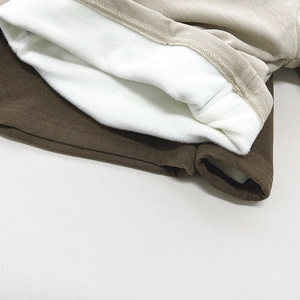 Detailed macro view of the thick white fleece lining on children warm thermal top