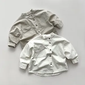 Close-up of kids' cotton linen long-sleeve shirts with mandarin collar and flap pocket