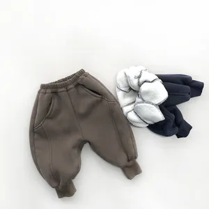 Detail view of thickened fleece lining on children's winter sweatpants with elastic waist