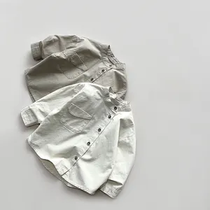 Detailed view of kids minimalist cotton linen shirts with stand collars and chest pockets