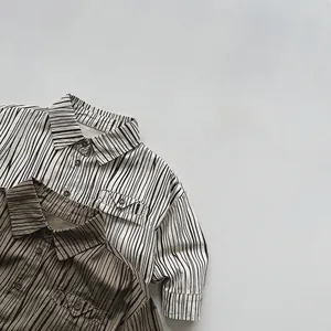 Detailed view of high-quality cotton vertical striped shirts for kids with utility pockets