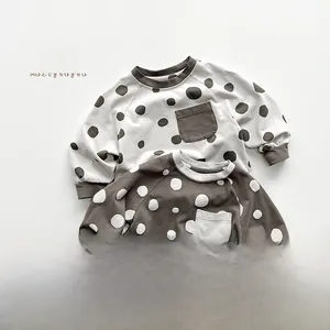 Detail of Korean style kids polka dot long sleeve T-shirts with chest pockets