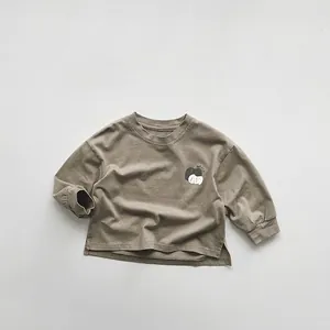 Detail of the side slits and soft ribbed cuffs on kids apple print sweatshirt