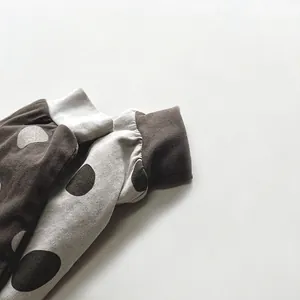 Kids' polka dot long sleeve T-shirt featuring ribbed cuffs and soft cotton fabric detail