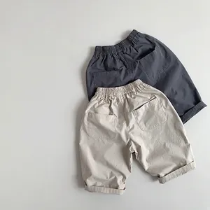 Kids loose casual thin cotton trousers in dark grey and beige with elastic waist