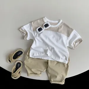 Kids summer casual set with khaki cotton t-shirt and cargo shorts in flat lay style