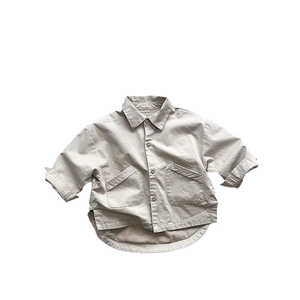 Kids Korean style khaki cotton shirt featuring double pockets and a curved hemline