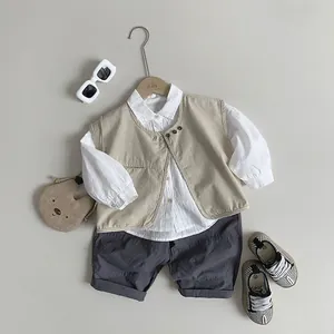 Kids three-piece casual set featuring a white shirt, beige vest and grey shorts
