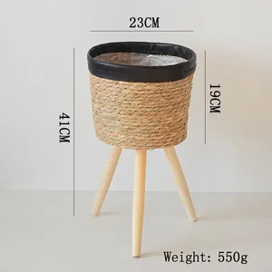 Detailed dimensions of woven plant stand with wooden legs: 41cm height and 23cm diameter