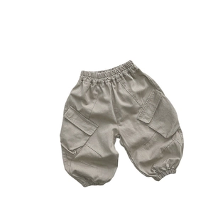Kids khaki cargo pants with elastic waist and ribbed cuffs on white background