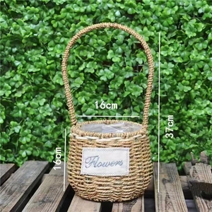 Detail showing natural woven flower basket dimensions of 16cm width and 37cm total height