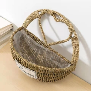 Detail of hand-woven straw basket with waterproof lining and Flowers decorative patch