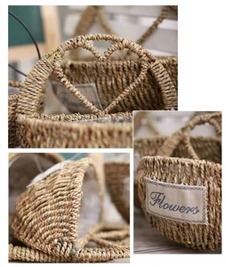 Detail of hand-woven straw basket with heart handle and decorative Flowers fabric label