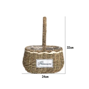 Detail view of a 32cm handmade straw flower basket with Flowers label and woven handle