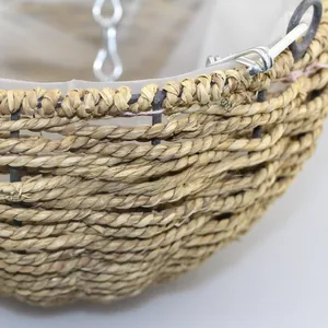 Close-up of natural woven fiber hanging planter with waterproof plastic lining and chains