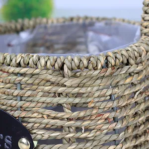 Detailed macro view of woven grass flower basket with metal frame and plastic lining