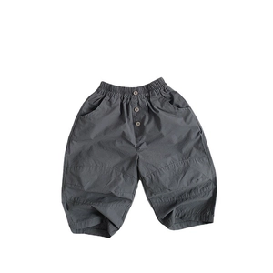 Kids loose casual thin dark grey cotton trousers with elastic waist and button details